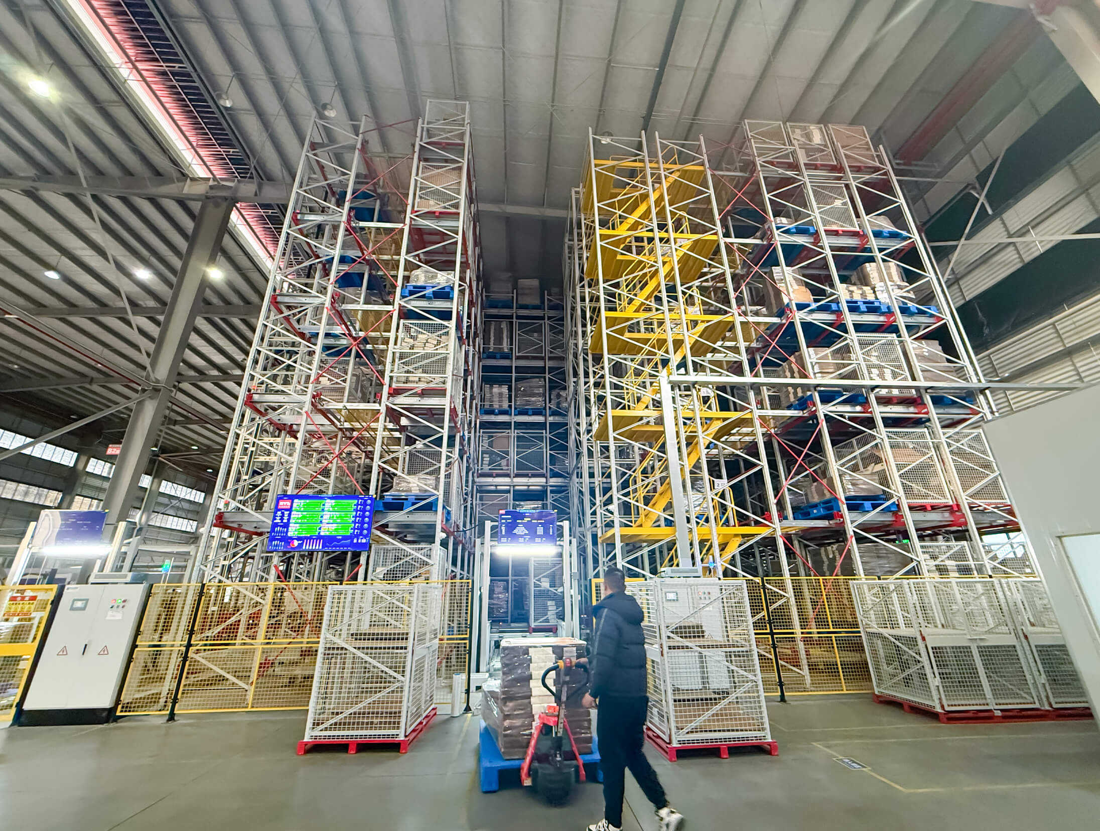 Forklift transporting palletized goods